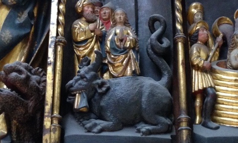 St Margaret and a black, four-legged dragon with one horn